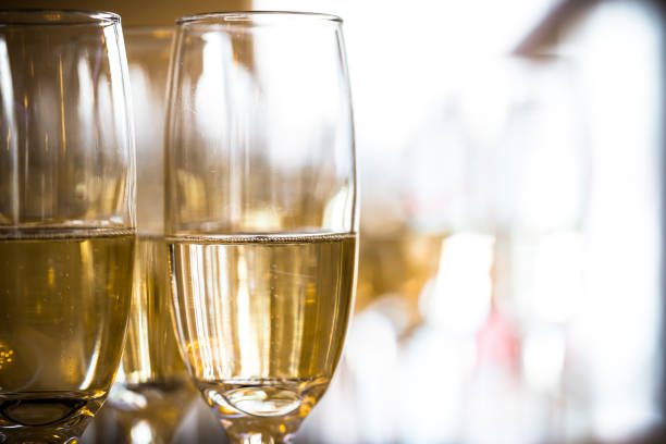 istock Two champagne glasses with sparkling golden wine 845570182