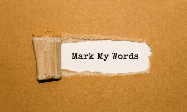 istock The text Mark My Words appearing behind torn brown paper 845571118