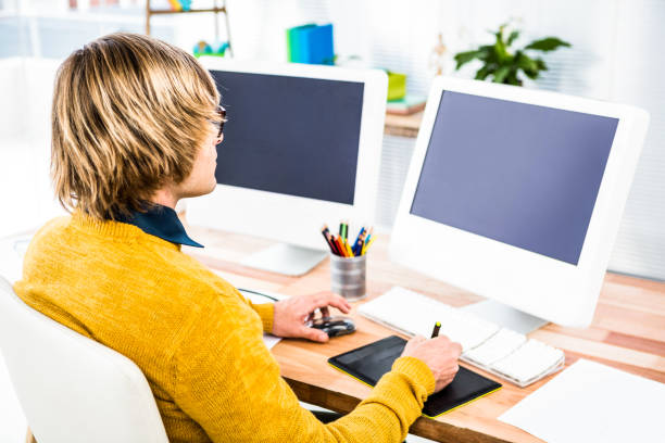 istock Rear view of hipster businessman using tablet graphic 845573680