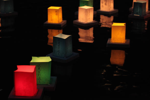 istock Candlelit lanterns floating on river at Fushimi 845579590