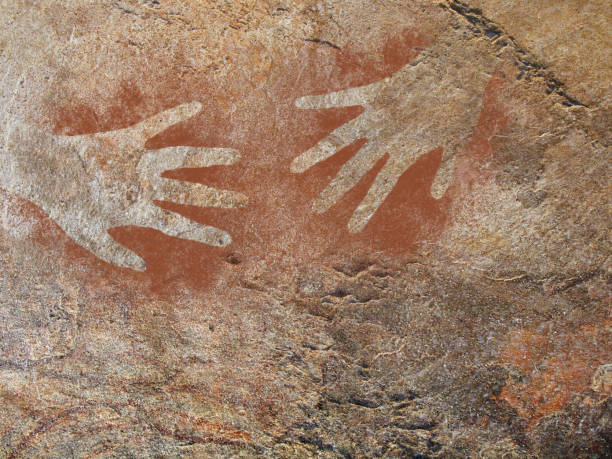 Hand painting stencil in the style of prehistoric cave art My hand - twice. aboriginal art stock pictures, royalty-free photos & images
