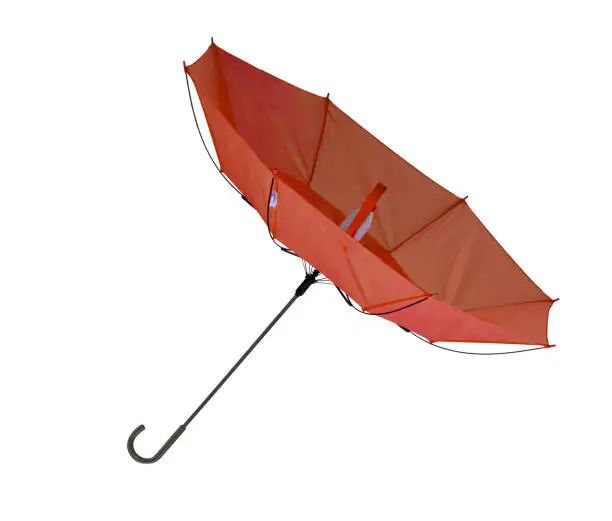 Photo of Umbrella, blown inside out, isolated on white.