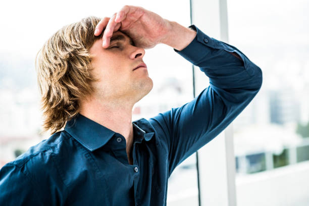 istock Troubled hipster businessman holding his head 845589520
