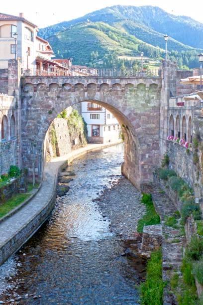 istock stone arch over the river in Potes, Spain 845589760