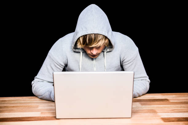 istock Man in hood jacket hacking a laptop 845592274