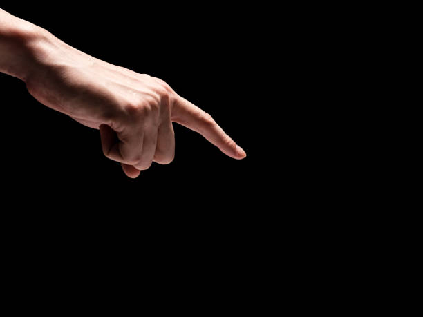 istock Male hands on a black background. Free space for text 845594992