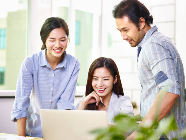 istock happy asian business team working in office 845596282