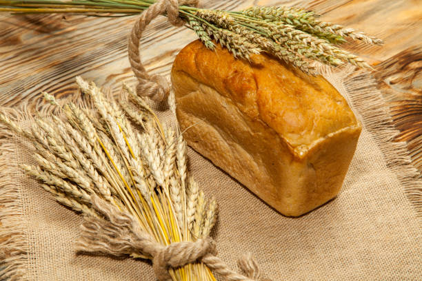 Freshly baked traditional bread on wooden table