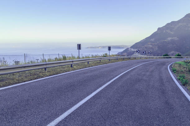 istock Road by the sea with blue sky 845602852