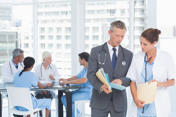 istock Male and female doctors with reports 845603036