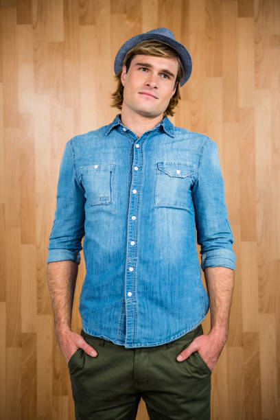 istock Serious hipster putting his hands in pockets 845611622
