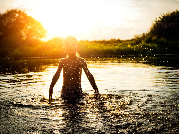 istock kids having fun at lake 845619134