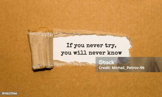 The Text If You Never Try You Will Never Know Appearing Behind Torn Brown Paper Stock Photo - Download Image Now