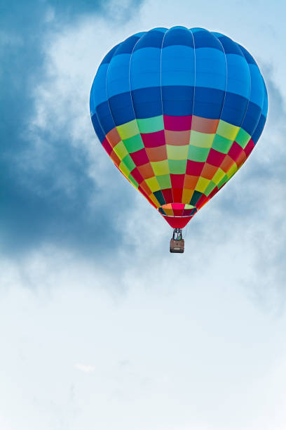 istock Colored hot air balloon flying on a blue sky 845628960