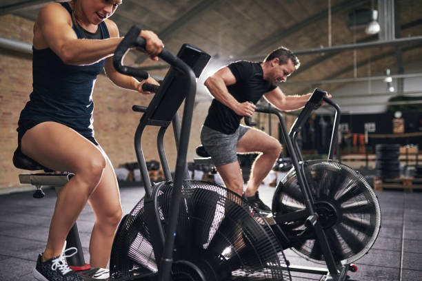 istock Man and woman training toughly on simulators 845636368