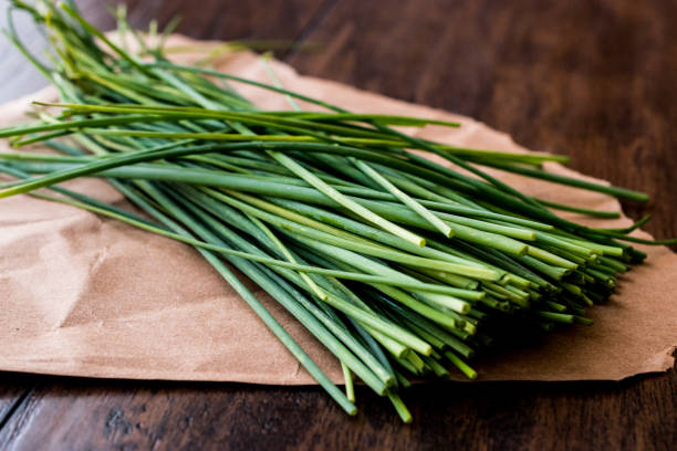 Fresh Chives / Siniklav or Frenk Sogani on wooden surface. Fresh Chives / Siniklav or Frenk Sogani on wooden surface. Organic Concept. chive photos stock pictures, royalty-free photos & images