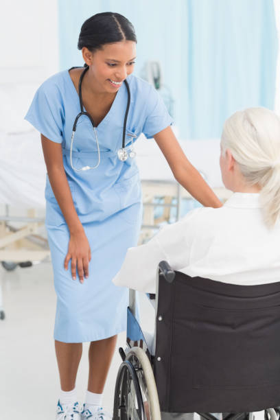 istock doctors and patient in wheelchair 845643160