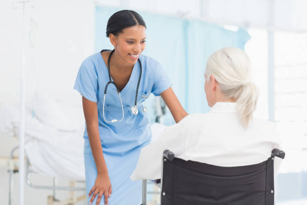 istock doctors and patient in wheelchair 845643194