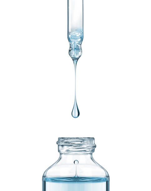 istock Drop falls from a pipette into a cosmetic bottle on white background 845646578
