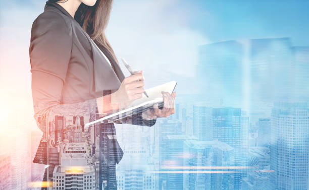istock Woman with a planner in a blue city 845646682
