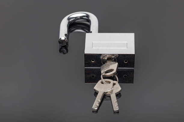 istock Unlocked Padlock And Key on a black background 845649976