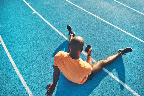 istock Young athlete checking his lap time on a cellphone 845653062