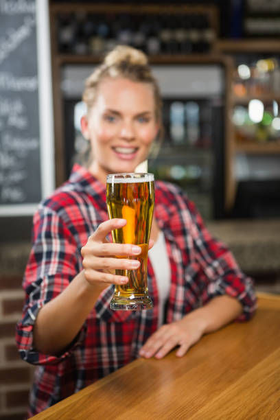 istock Pretty smiling woman having a beer 845653822