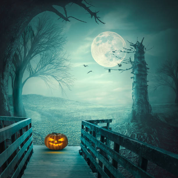 Scary Halloween pumpkin on wooden bridge at full moon night