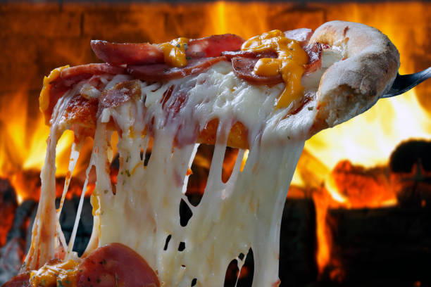 istock Hot pizza slice with melting cheese 845654290
