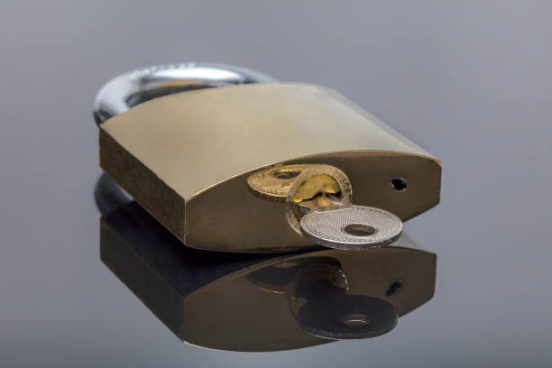 istock Unlocked Padlock And Key on a black background 845654934