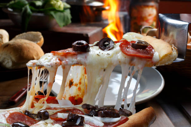 istock Hot pizza slice with melting cheese 845660504