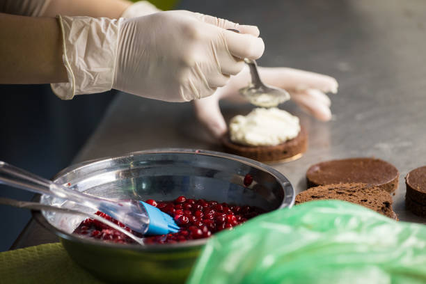 istock preparation of cakes with cream and berries, 845663376