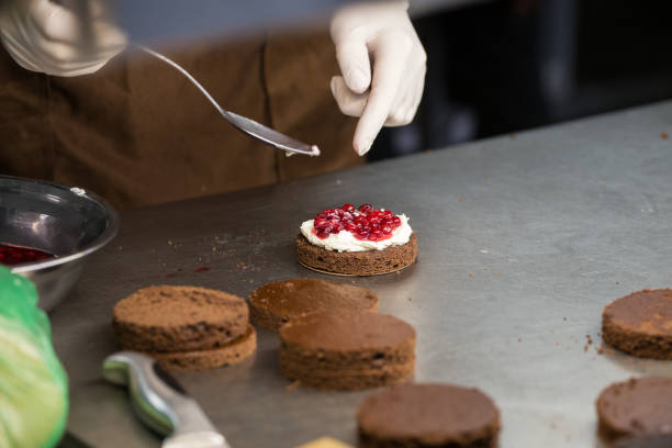 istock preparation of cakes with cream and berries, 845663390