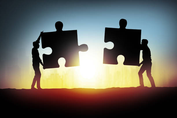 istock businessman connecting jigsaw puzzle pieces 845663476