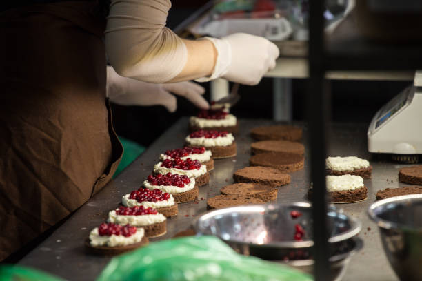 istock preparation of cakes with cream and berries, 845663518