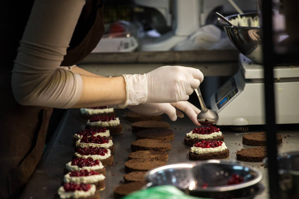 istock preparation of cakes with cream and berries, 845663520