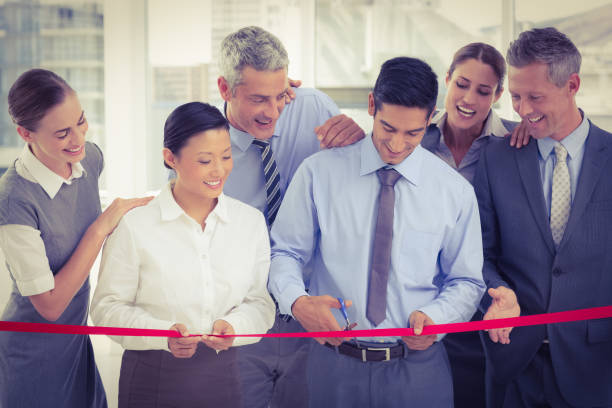 istock Business man cutting red strip 845664062
