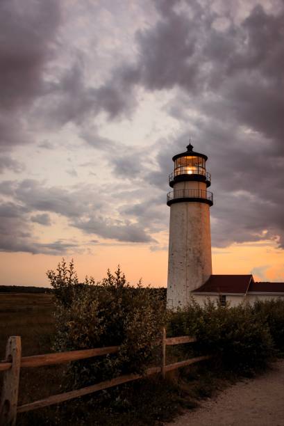 istock New England Lighthouse at dusk 845667378