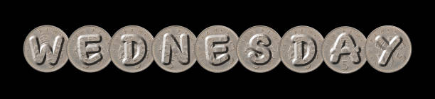 istock WEDNESDAY – Coins on black background 845669952