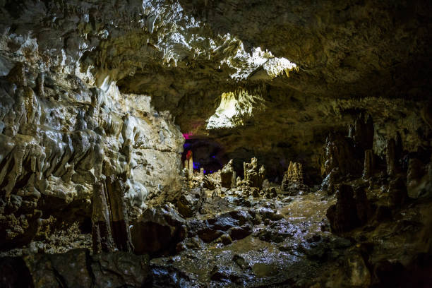 istock Tunnel in cave with stalactites and stalagmites 845673788