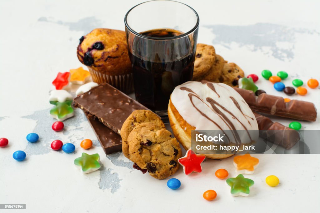 Assortment of products with high sugar level Assortment of products with high sugar level. Food that's bad for skin and teeth. Space for text Sugar - Food Stock Photo