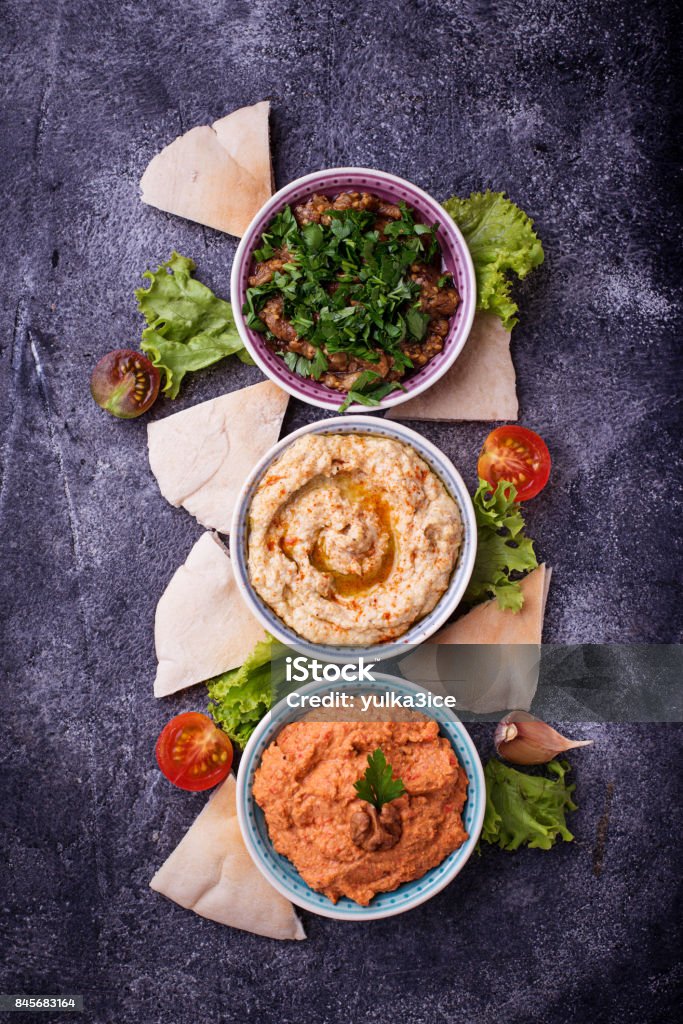 Selection of Middle Eastern or Arabic appetizers Selection of Middle Eastern or Arabic appetizers. Top view Baba Ghanoush Stock Photo