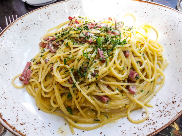 istock Spaghetti Carbonara with bacon and creme at restaurant shot with natural light. 845687640
