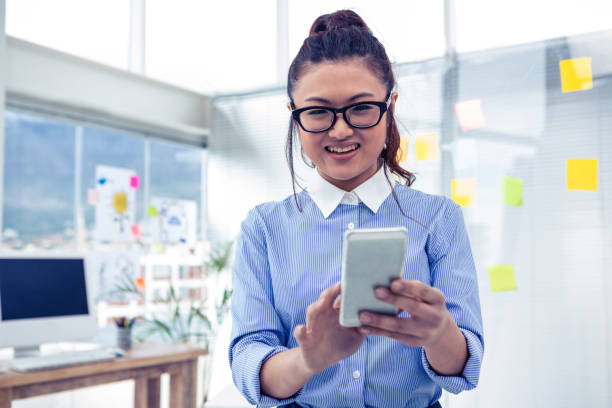 istock Asian businesswoman using smartphone 845688052