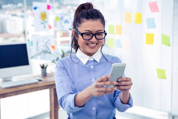 istock Asian businesswoman using smartphone 845688114