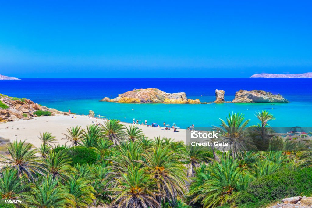 Scenic landscape of palm trees, turquoise water and tropical beach, Vai, Crete, Greece. Crete Stock Photo