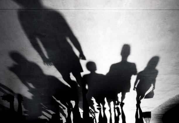 istock Blurry shadows of people walking 845696606
