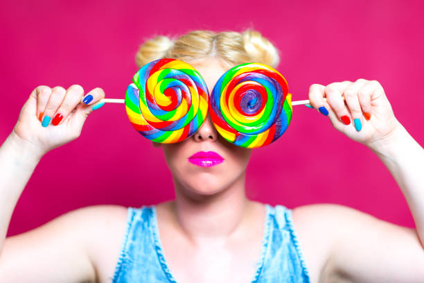 istock Blonde beauty with Lollipops in Hand 845696700