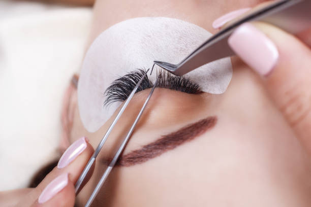 istock Eyelash Extension Procedure. Woman Eye with Long Eyelashes. Lashes, close up, macro, selective focus 845706294
