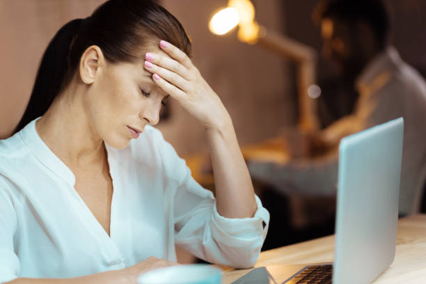 istock Upset businesswoman dreaming about holidays 845709344